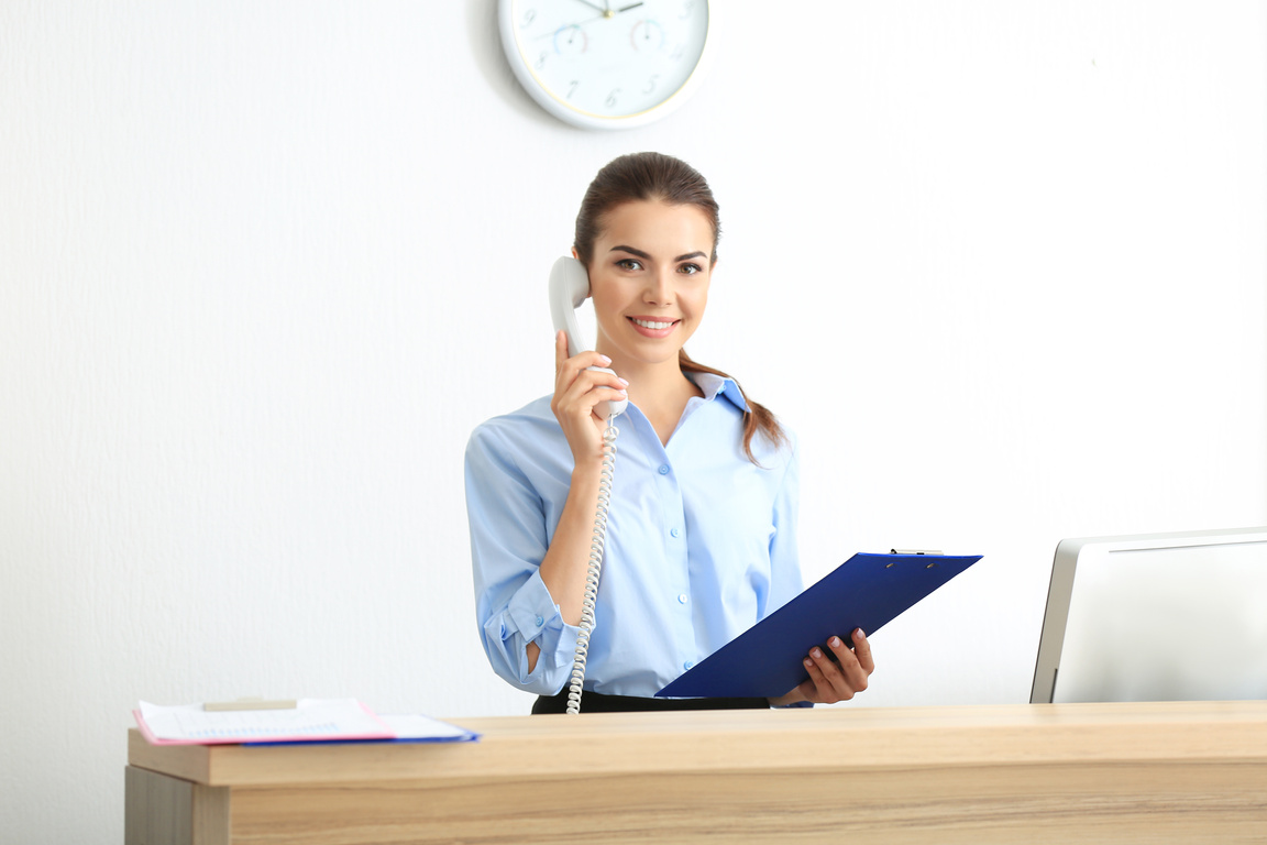 A Young Female Receptionist at Work